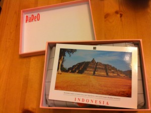 A postcard from Indonesia inside the box.